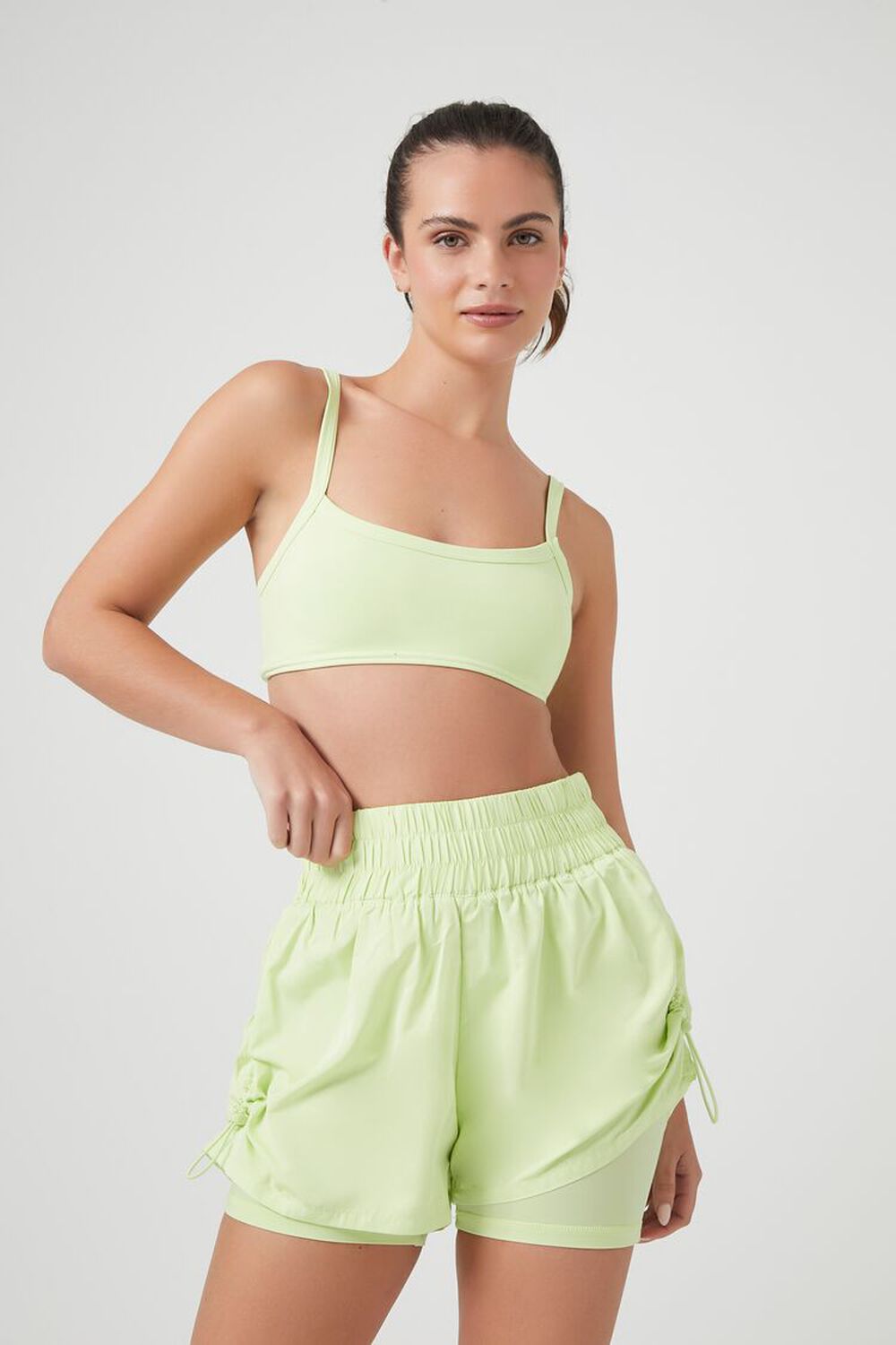 green ruffle top matching sports bra and biker shorts