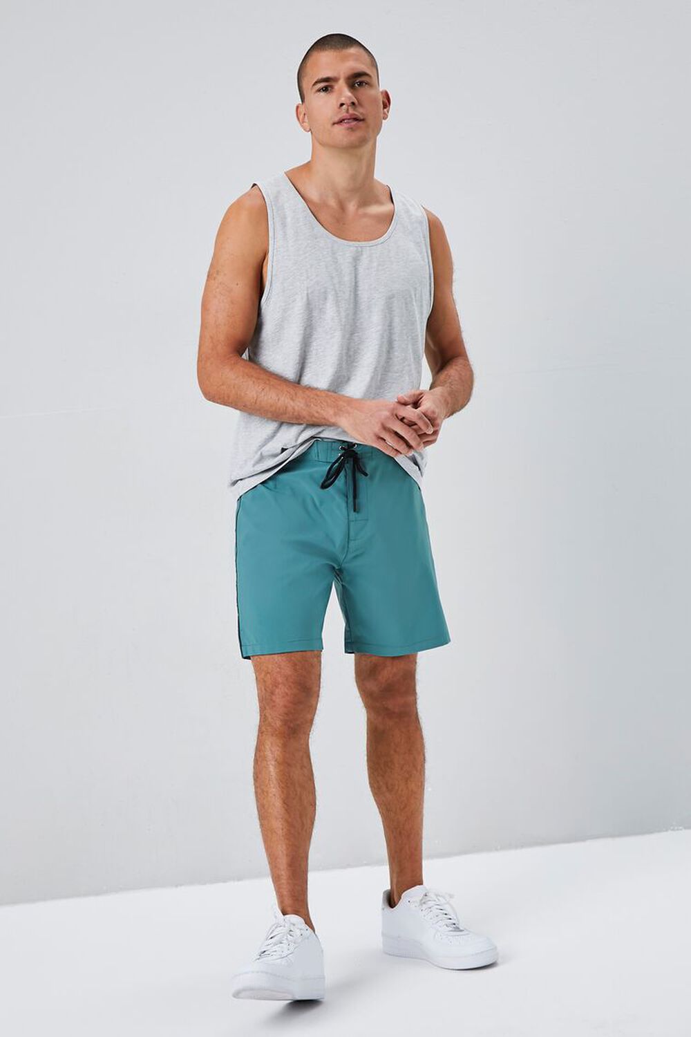 ASOS DESIGN swim shorts in short length with contrast waistband in